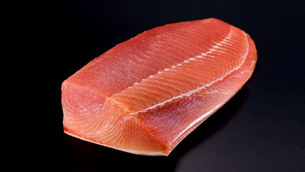 moonfish loin on black background