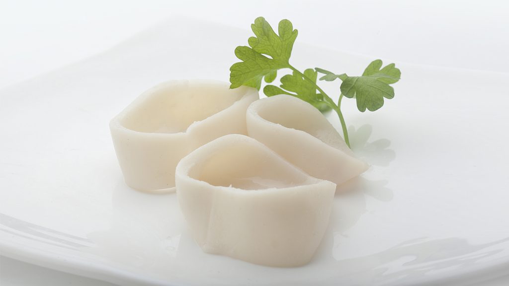 giant squid ring and coriander on white plate